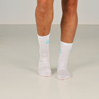 Tynne - Hvite Gripsocks med turkis logo